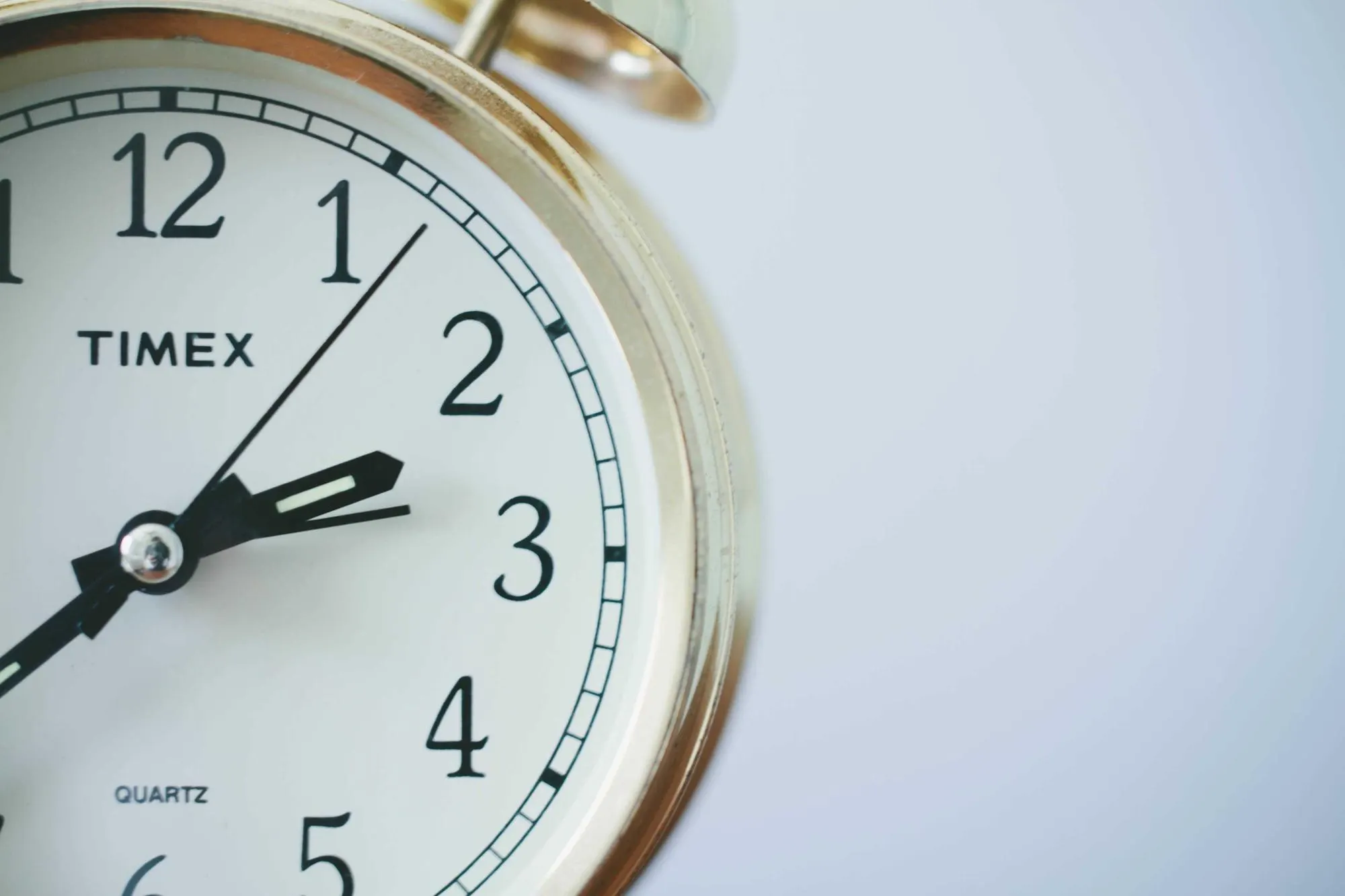 Close-up of an analogue alarm clock face